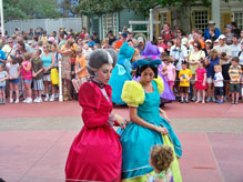 Cinderella's Stepsisters talk to children along the parade route